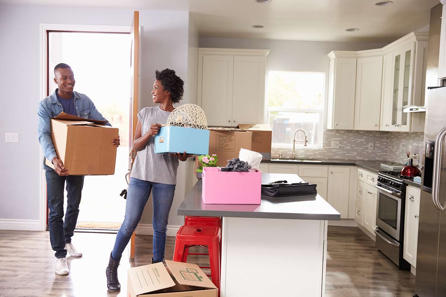 a couple moving into their new house
