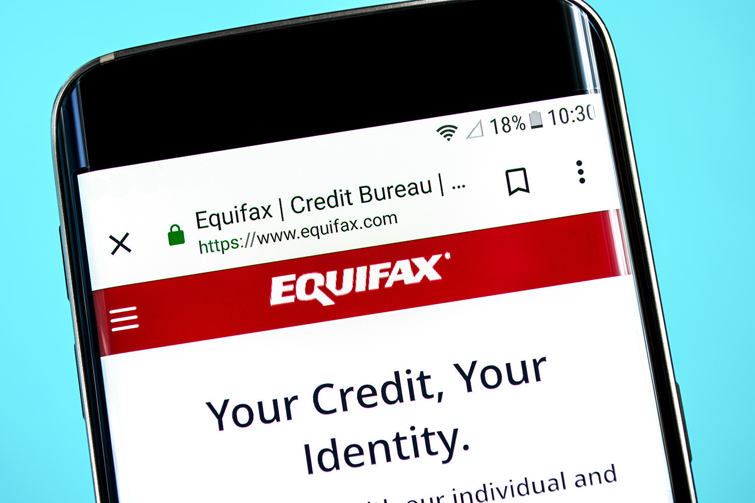 A phone screen with an article from Equifax pulled up.