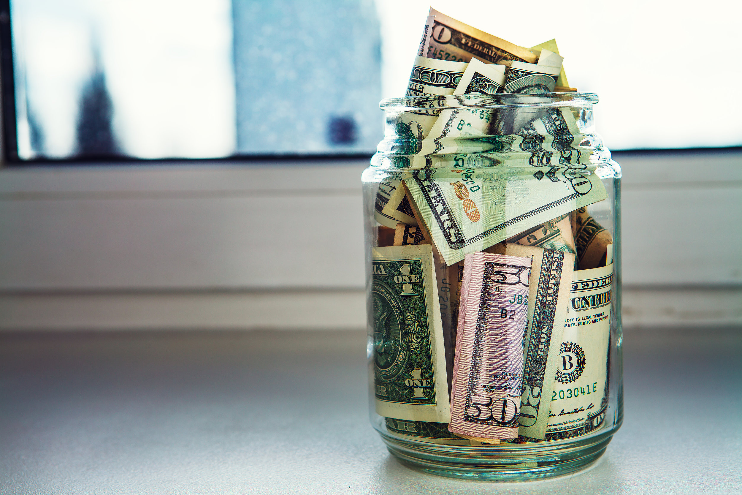 We’re not opposed to saving some cash in a jar, but why keep it there when you can earn interest with a financial institution?