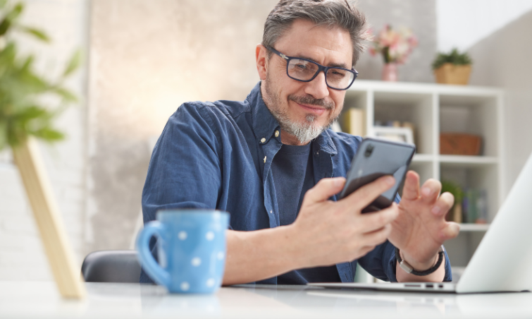 smiling man with mobile phone