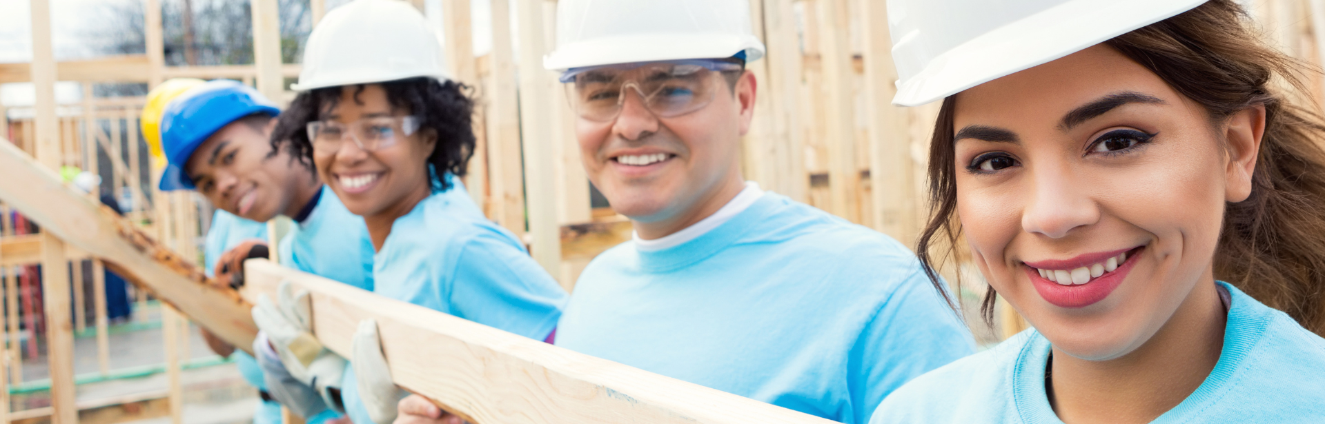 volunteers smiling during construction build