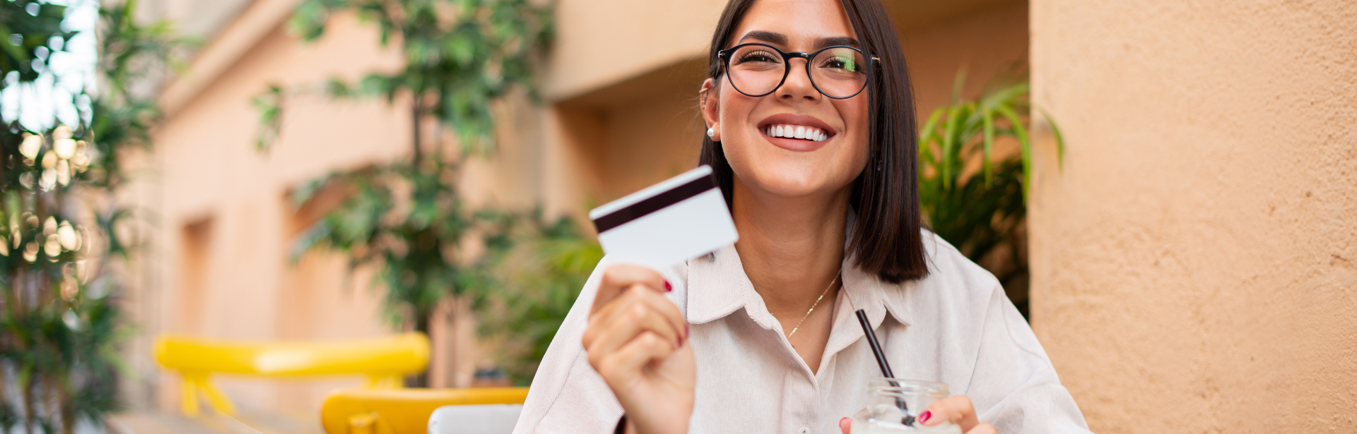 woman smiling with credit card